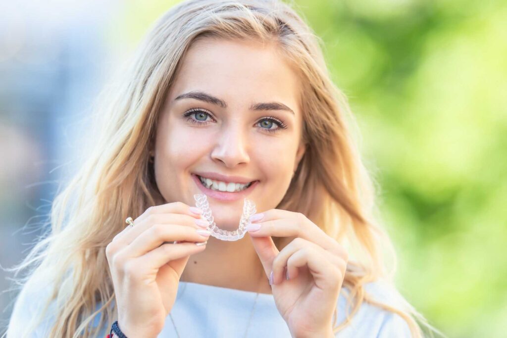 Girl with Invisalign Retainer