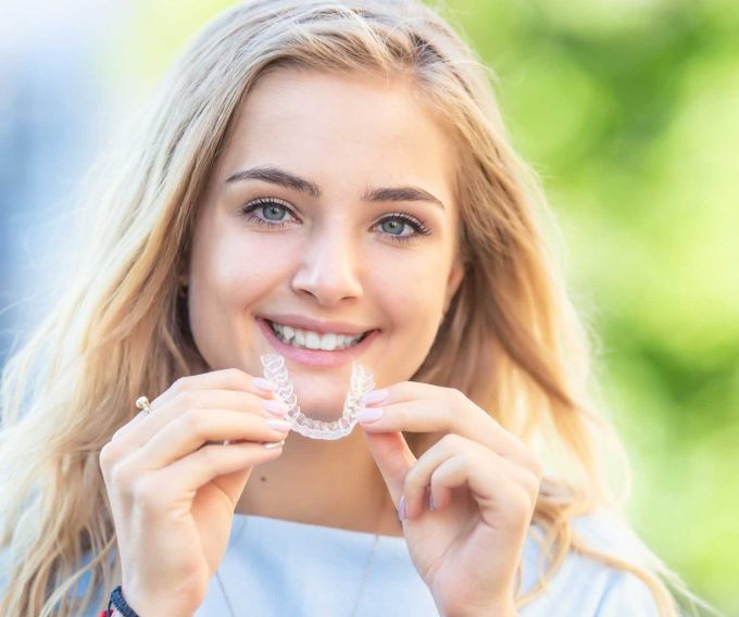 Girl with Invisalign Retainer